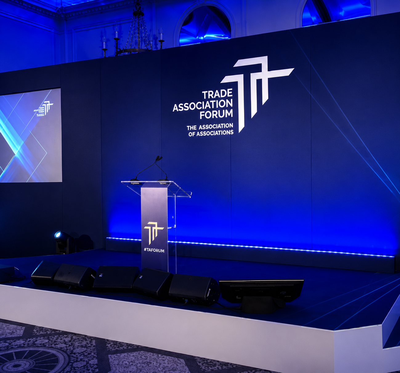 Modern acrylic lectern on a conference stage for keynote presentations and corporate events